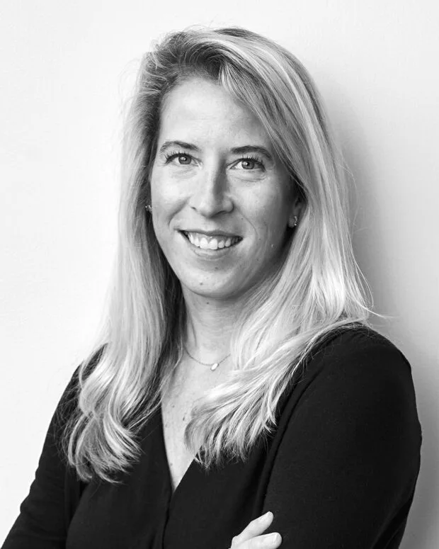 A black and white portrait of Amy Kronenthal
