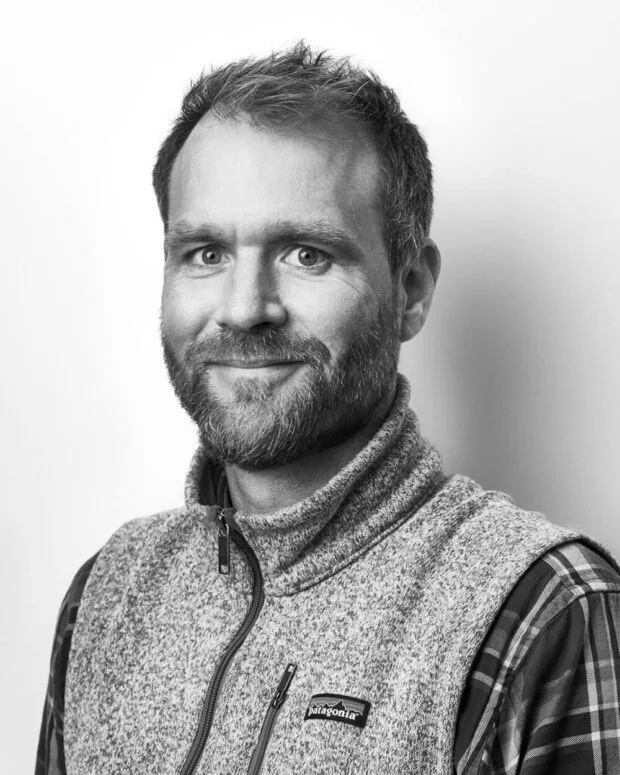 A black and white portrait of Peter Floeckher