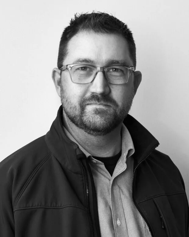 A black and white portrait of Leon Genre