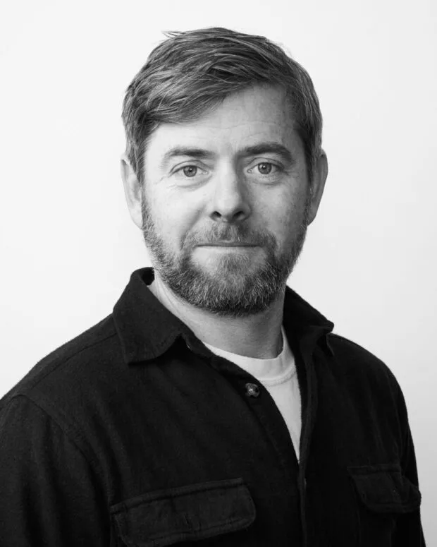 A black and white portrait of Logan Livingston
