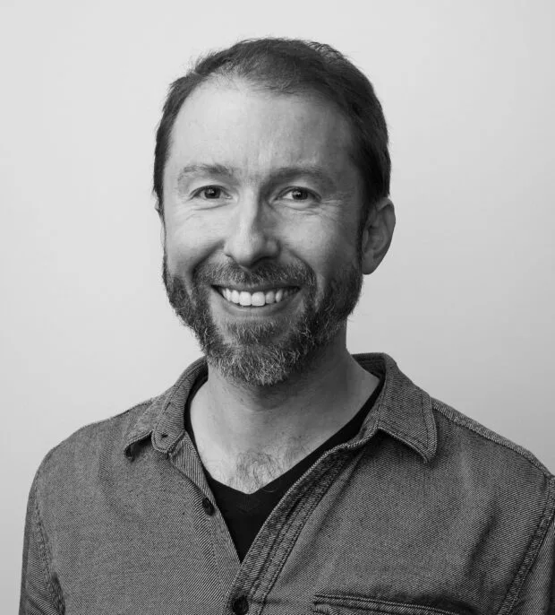 A black and white portrait of Steve Frens
