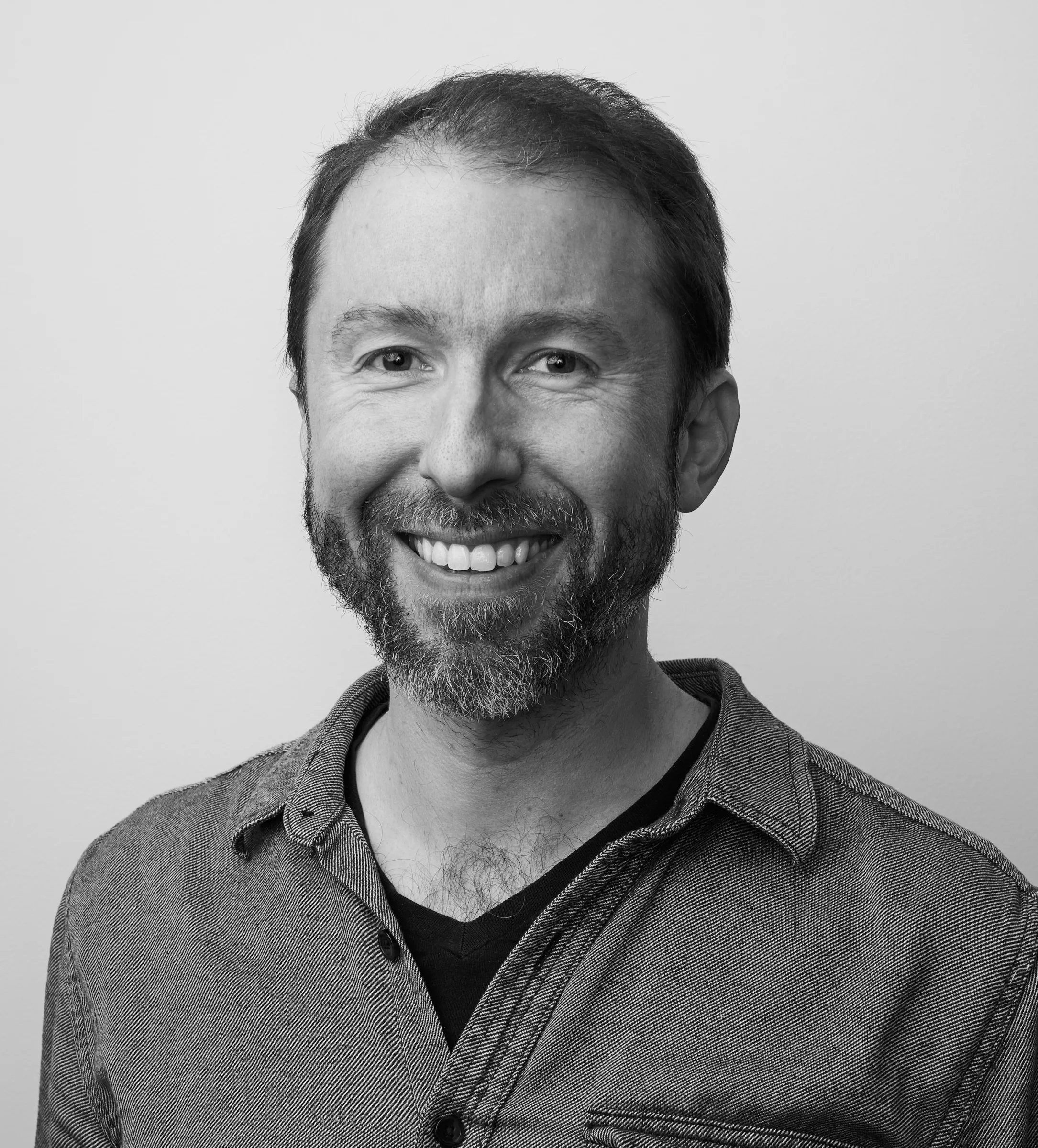 A black and white portrait of Steve Frens