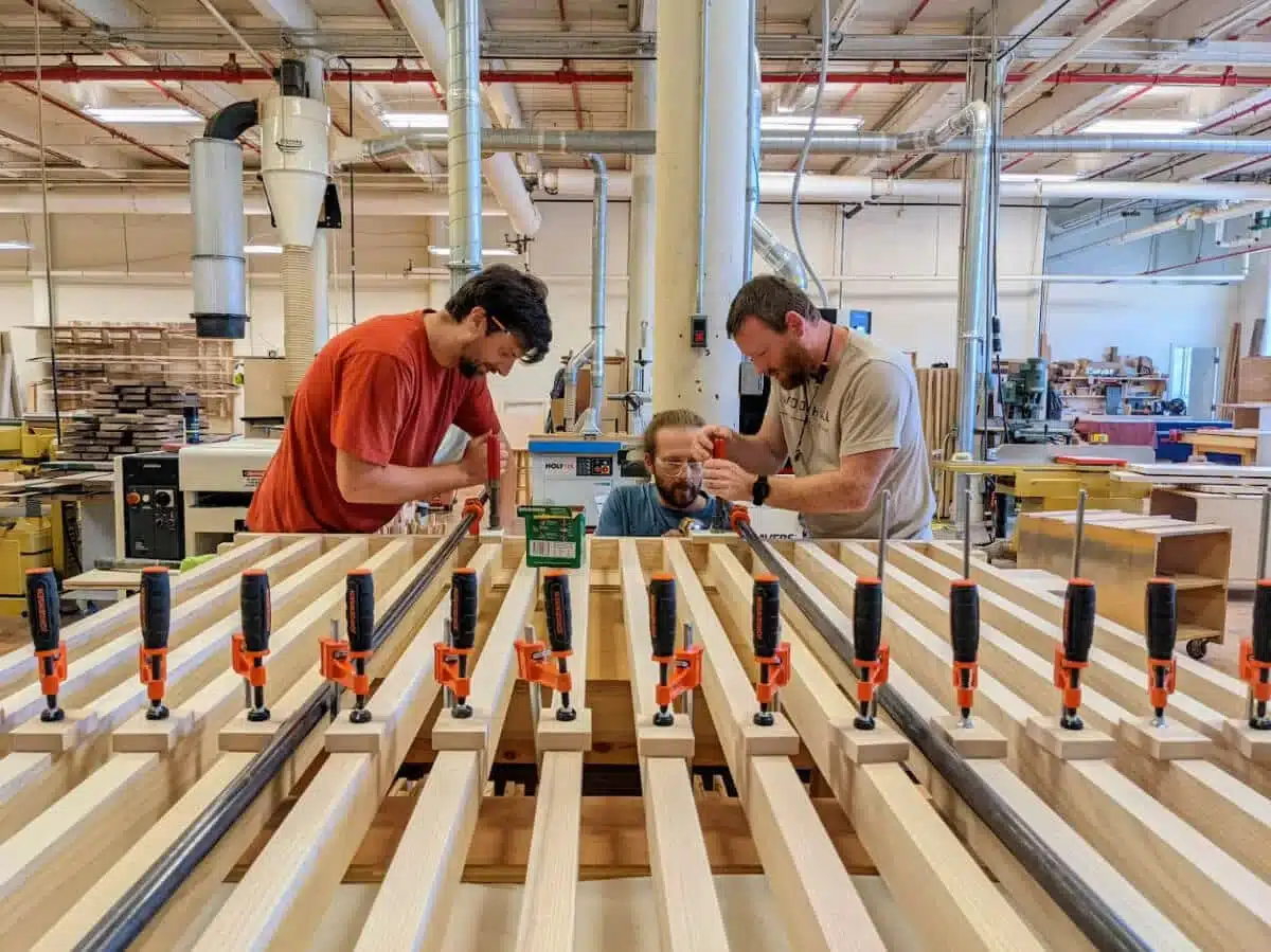 Woodhull millshop team members work together