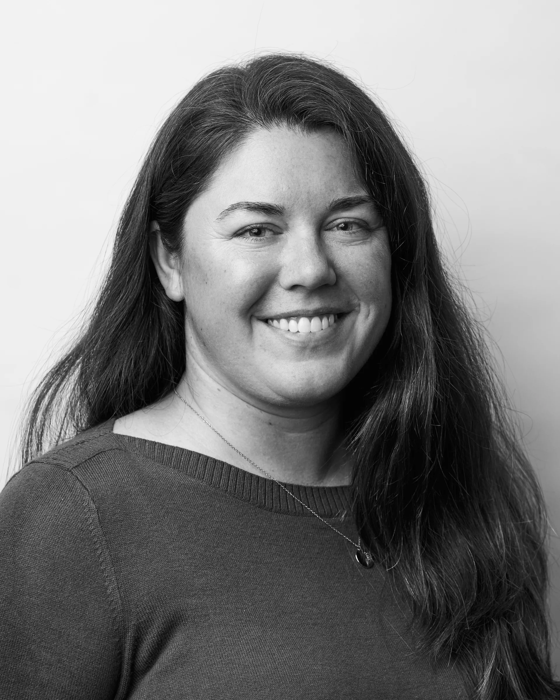 A black and white portrait of Amy Andrew