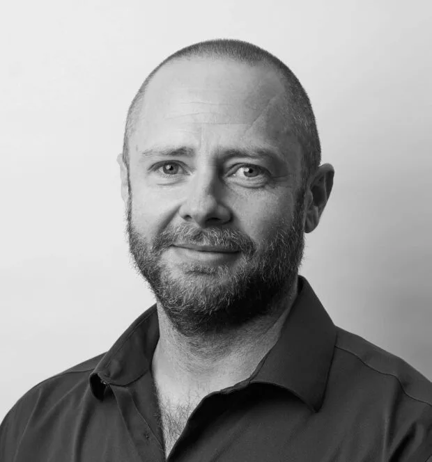 A black and white portrait of Butch Mockler