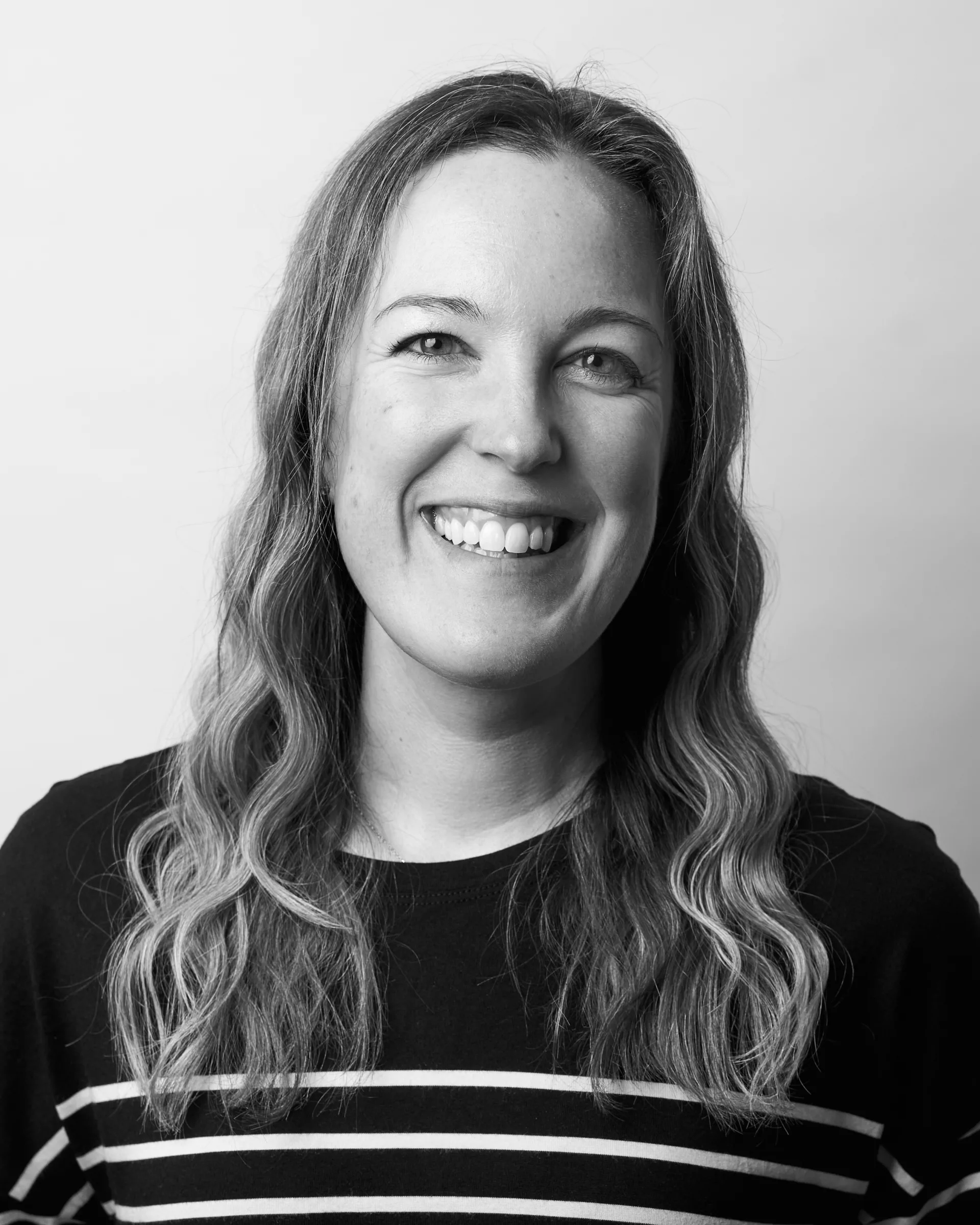 A black and white portrait of Danielle Camarata