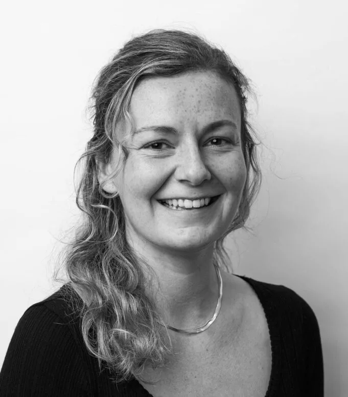 A black and white portrait of Emma Olson
