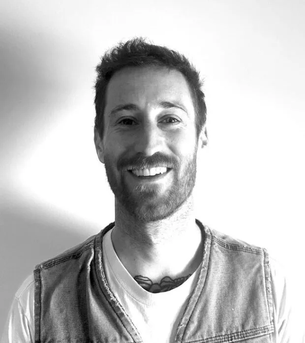 A black and white portrait of Ryan Hunt