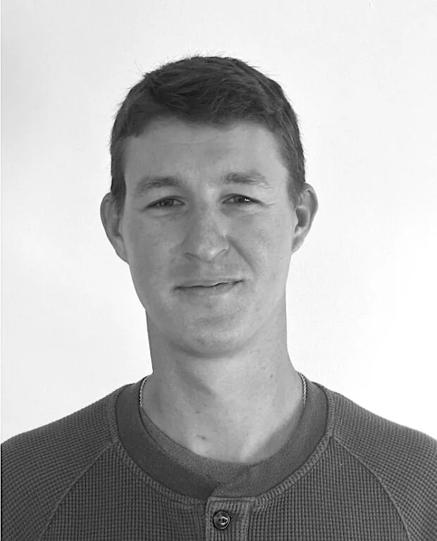 A black and white portrait of Ian Duncan